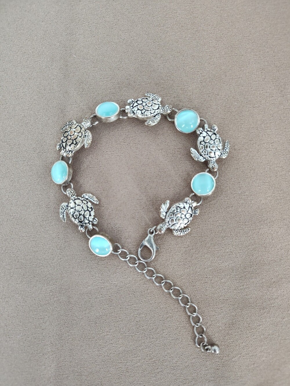 Silver Tone Turtle Link Bracelet with Light Blue Cabochons